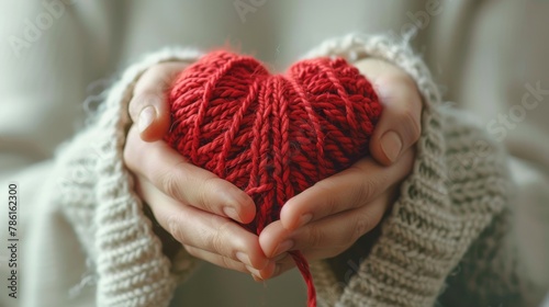 Greeting card depicting love and concern. A woman knits a red heart for her loved one.