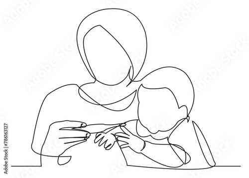 mom measures the temperature of the baby