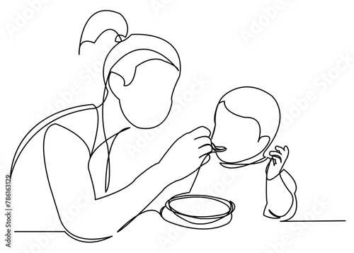 mom feeds baby porridge