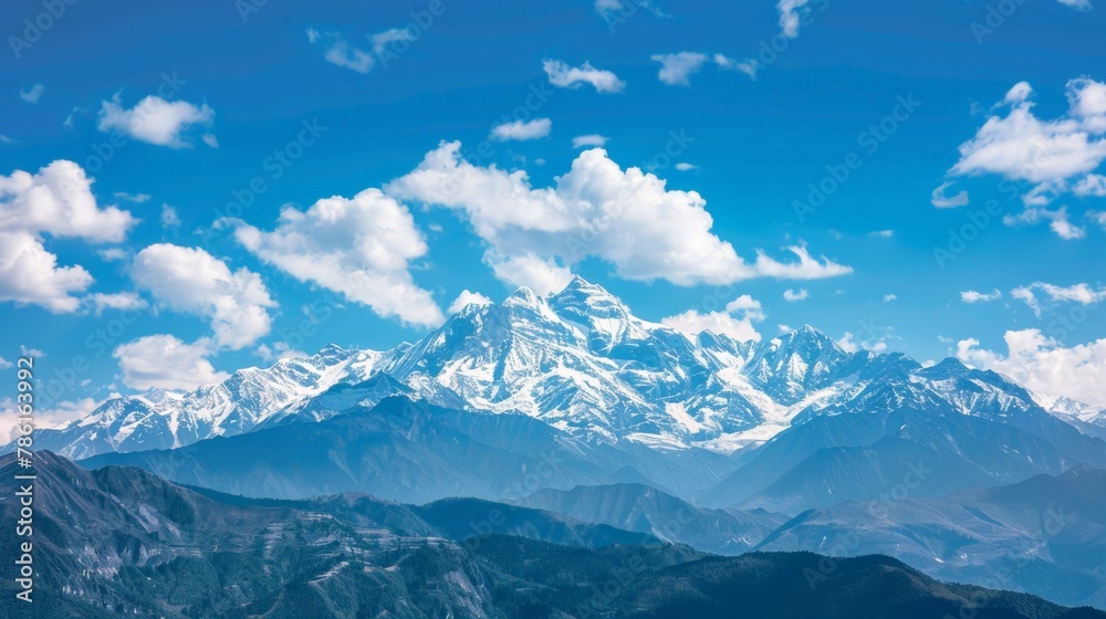 Majestic mountain landscape with snow peaks under blue sky Majestic mountain landscape with snow peaks under blue sky