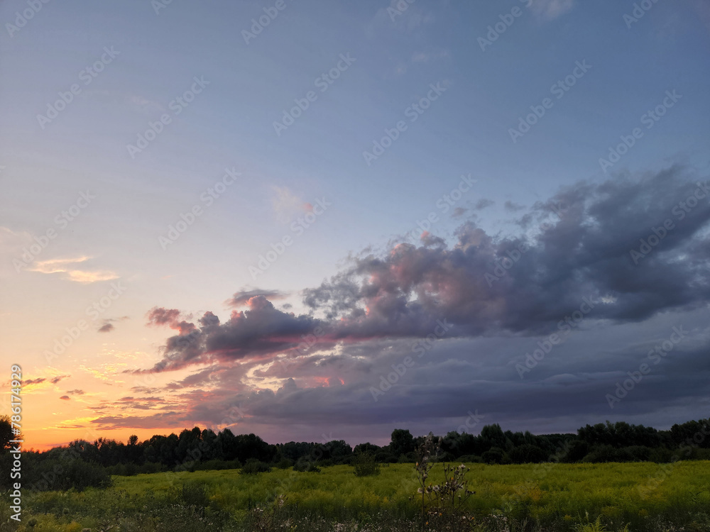Evening landscape with clouds. Landscape in cloudy weather Evening landscape with clouds. Landscape in cloudy weather