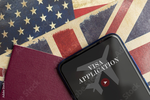 Uk and USA visa application concept: a smartphone and a blank passport over a uk and usa flags