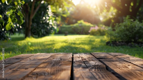 Wooden table in the garden at sunset. Selective focus.