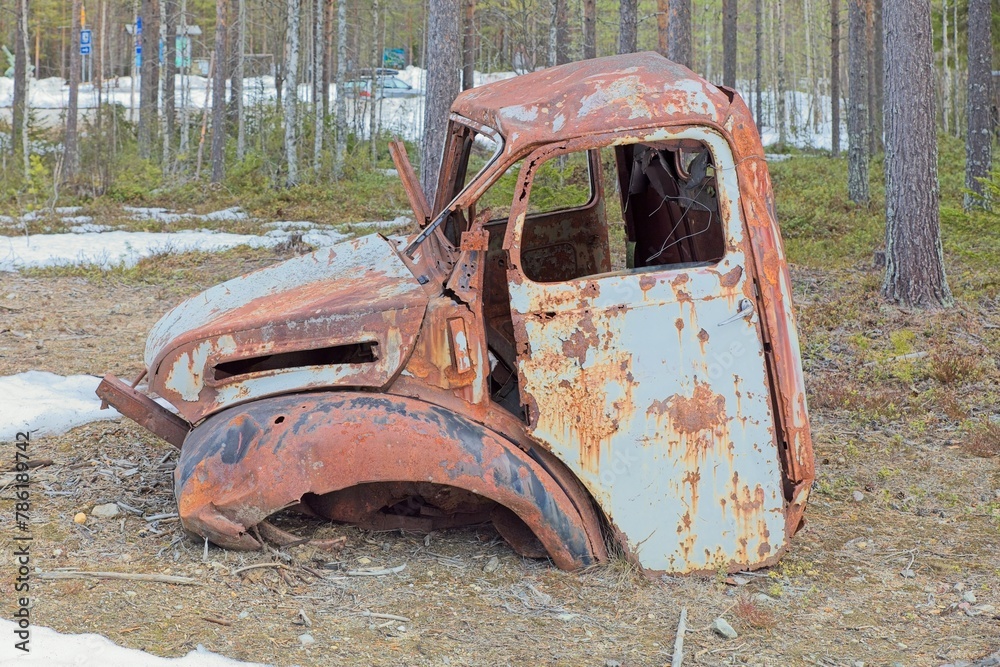 Remains of a torn up cab of a old truck.