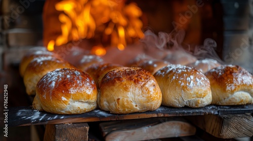 Bread rolls baking on tray by fire, staple food ingredient in cooking process