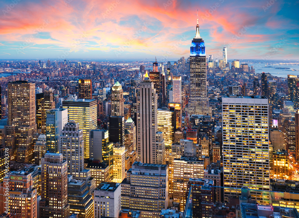 Fototapeta premium New York City skyline with urban skyscrapers at sunset, USA.
