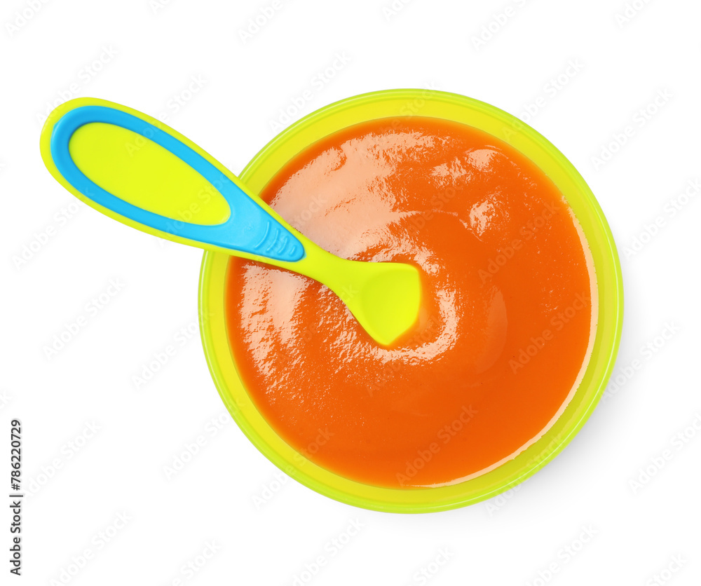 Delicious baby food and spoon in bowl isolated on white, top view Delicious baby food and spoon in bowl isolated on white, top view