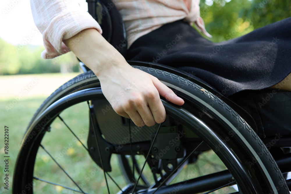 Close-up of a person using a wheelchair, focusing on independence and mobility Close-up of a person using a wheelchair, focusing on independence and mobility
