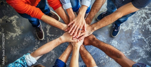 Diverse hands joining in teamwork, empathy, partnership, and social connection in business