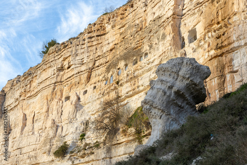 Natural walk next to the júcar river, popular cave houses, carved into the mountain,  region of La Manchuela, in Alcalá del Júcar (Albacete, Spain). photo