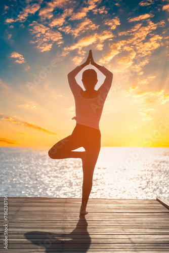 Young woman practicing yoga during yoga retreat in Asia, relaxation, exercise