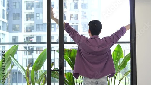 Young Asian man at home