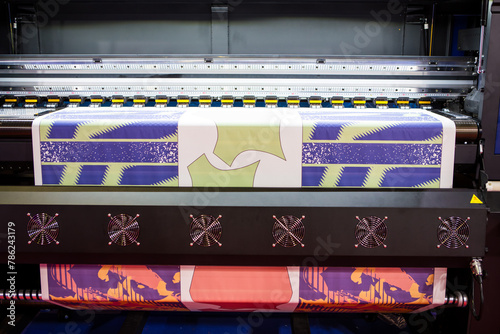Sublimation printer printing T shirt show in Garment and Textile Manufacturing Industry.	
