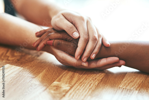 Empathy, people and holding hands for support, help and comfort during grief, mourning and care for healing. Trust, friends and embrace for loss, mental health and to show love for hope or assurance photo