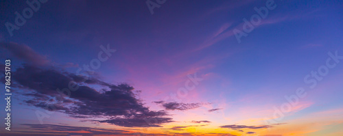 Clouds and orange sky,Real majestic sunrise sunset sky background with gentle colorful clouds without birds.Panorama, large photo