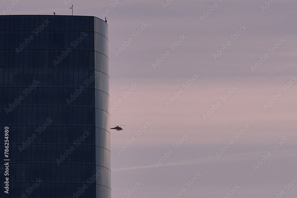 Obraz premium An helicopter appears behind a crystal tower