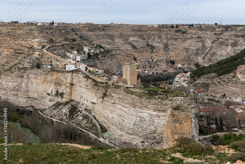 Panoramic view of the town of Alcalá del júcar from Casas del Cerro. Its popular cave houses, carved into the mountain, the castle and Church of San Andrés in the gorge of the júcar rive, Albacete.