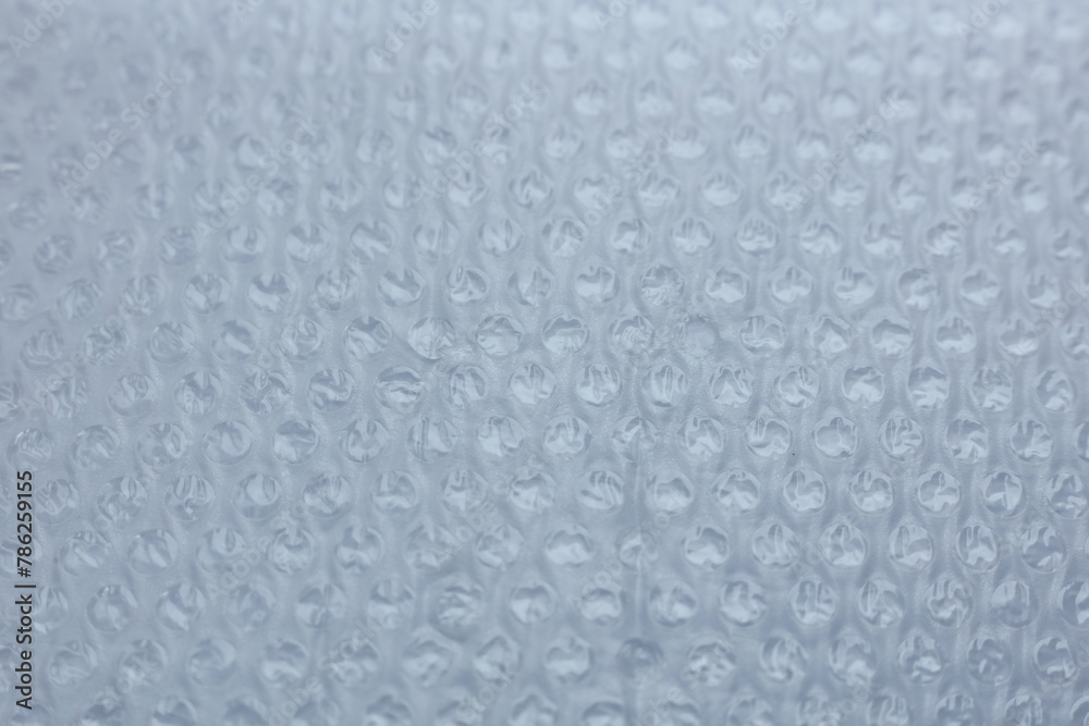 Close-up of a sheet of plastic wrap with bubbles. Abstract background. Close-up of a sheet of plastic wrap with bubbles. Abstract background.