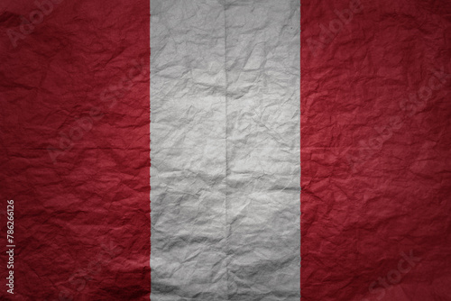 big national flag of peru on a grunge old paper texture background
