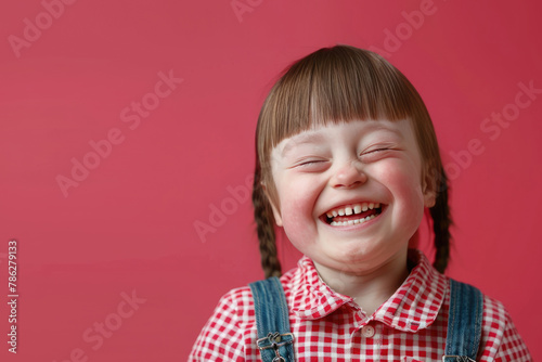Portrait of happy child girl with down syndrome looking at camer photo