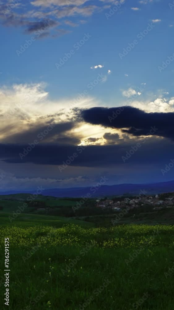 Beautiful landscape with field at sunset in Tuscany, Italy, zoom in timelapse. Vertical video Beautiful landscape with field at sunset in Tuscany, Italy, zoom in timelapse. Vertical video