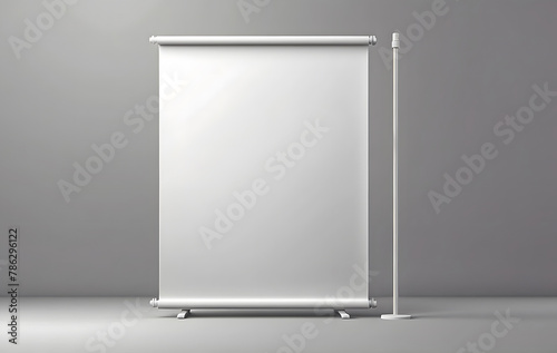 A white roll-up banner mockup stands against a gray wall, A White pop-up advertising display template design