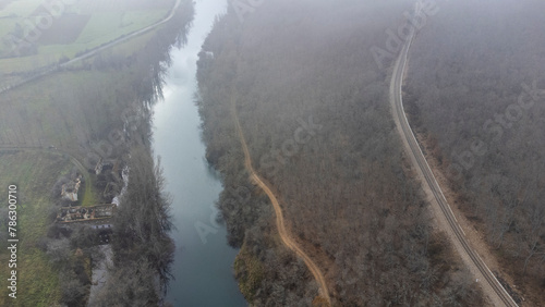 esla river from drone in winter morning next to road and train track