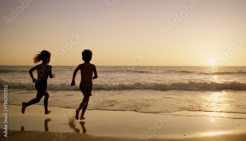 Wallpaper Mural children running toward the water at a beach at dusk Torontodigital.ca