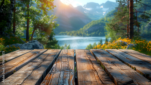Wooden boardwalk on the background of the lake and mountains.