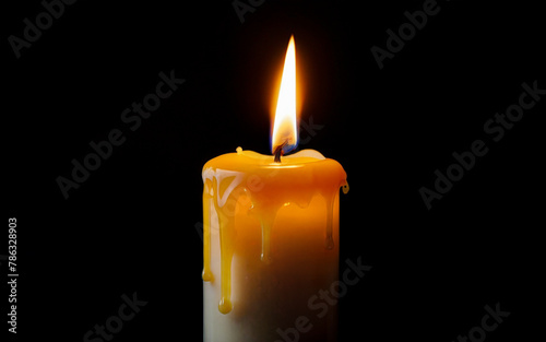 yellow burning candle with dripping wax close-up