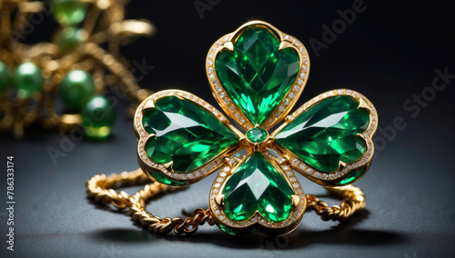 A clover leaf made of gold and green gemstones