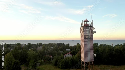 Red Hill Lighthouse, Russia. Calm and magical sunset at the picturesque cape. photo