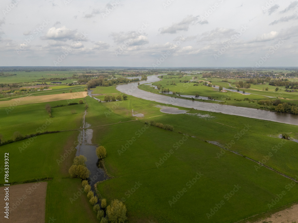 Aerial View: Countryside Road along the IJssel River Dike in Netherlands
