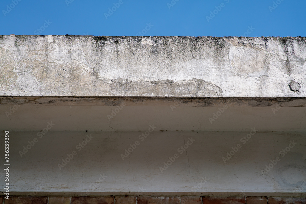 cornice facade of the building with infiltration and erosion of the plaster. the problems of disintegration and degradation of reinforced concrete are widespread in many buildings. facade bonuses cornice facade of the building with infiltration and erosion of the plaster. the problems of disintegration and degradation of reinforced concrete are widespread in many buildings. facade bonuses