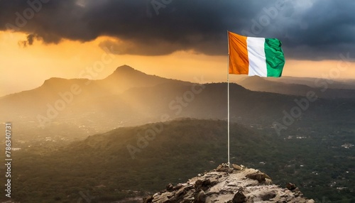 The Flag of Cote d’Ivoire On The Mountain. photo