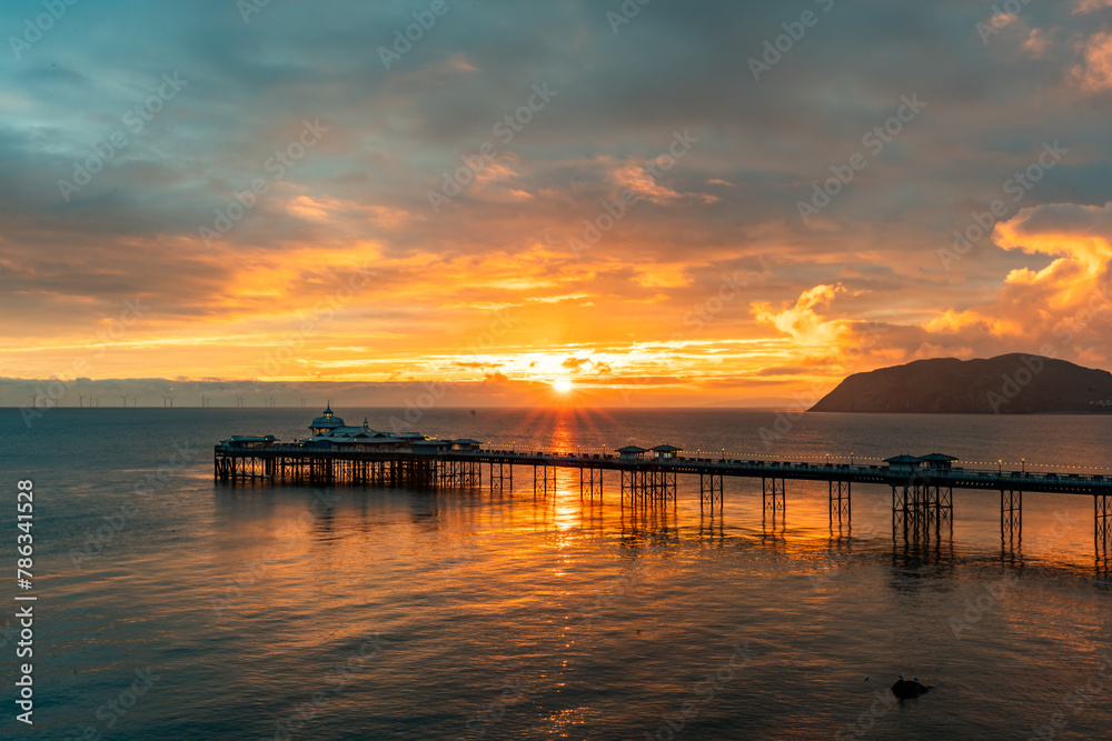 Sunrise over llandudno Pier with the tide in Sunrise over llandudno Pier with the tide in