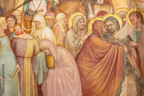 Detail of colorful religious painting showing women mourning the death of Jesus