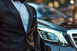 professional chauffeur standing near luxury car exceptional service concept closeup photo