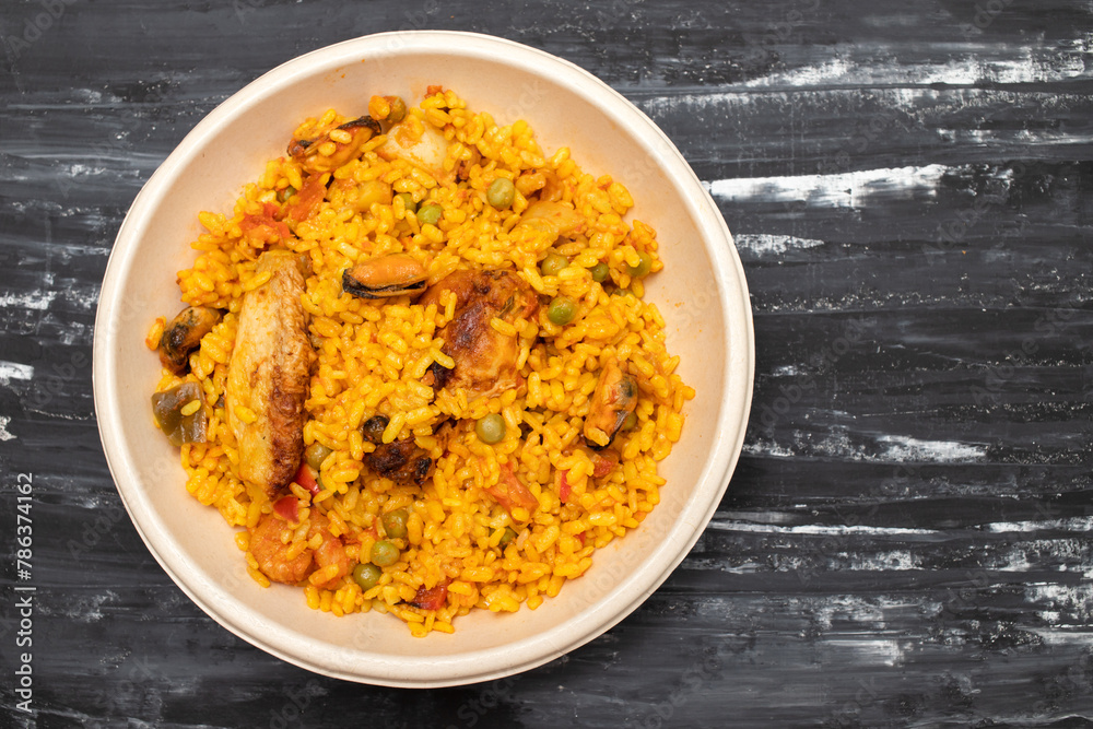 typicla spanish dish paella in plastic plate typicla spanish dish paella in plastic plate