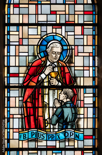 Saint Pope Pius X. A stained-glass window in Église de la Sainte-Trinité (Holy Trinity Church) in Walferdange, Luxembourg. photo