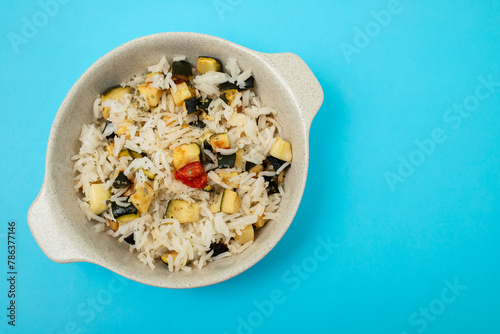 Boiled rice with vegetables in small bowl