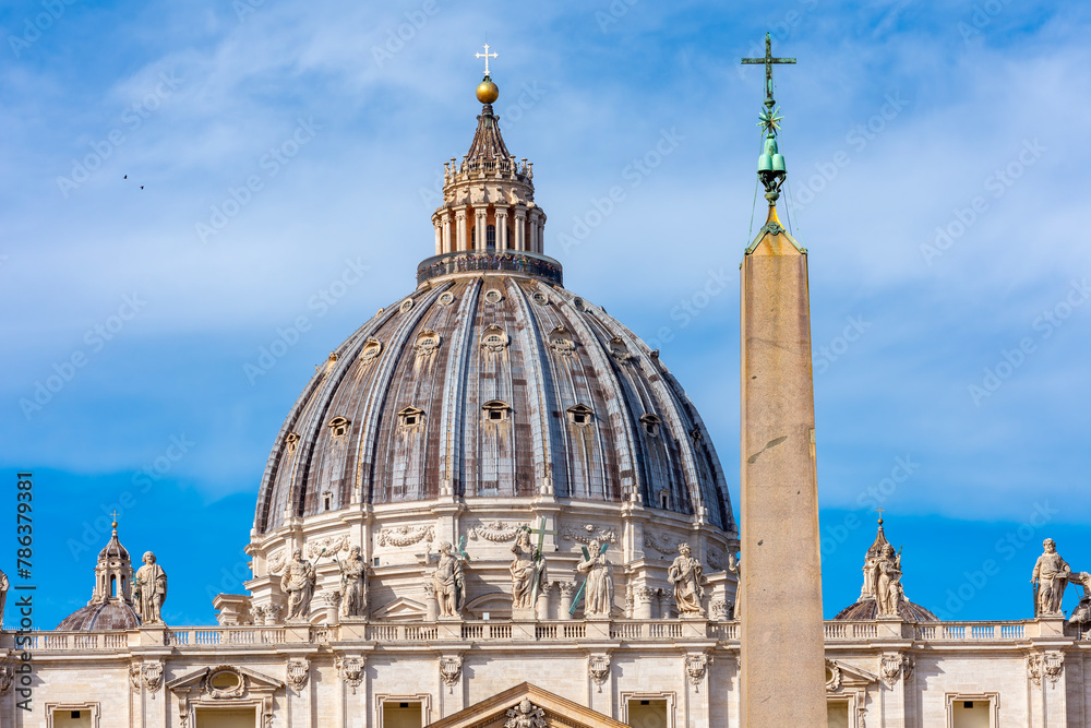 Obraz premium St. Peter's basilica dome and Egyptian obelisk on St. Peter's square in Vatican
