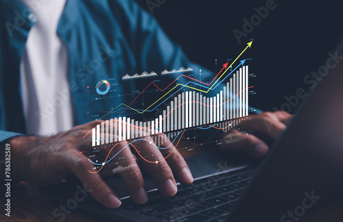 Analyst working on business analytics dashboard with KPI, charts and metrics to analyze data and create insight reports for executives and strategical decisions. Corporate strategy for finance. photo