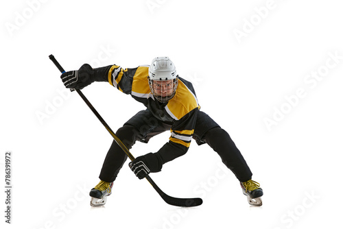 Canvas Print Highly concentrated man, hockey player wearing helmet and protective uniform standing in position with stick during game isolated on white background