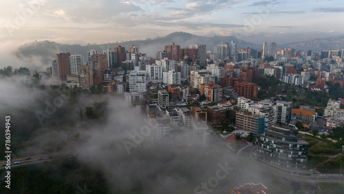 Aerial drone view of Quito capital city of Ecuador South America Parque La Carolina Sunrise early morning traffic © John