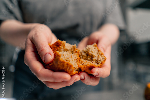 close-up of a hand with a broken piece of cake in a professional kitchen © Guys Who Shoot