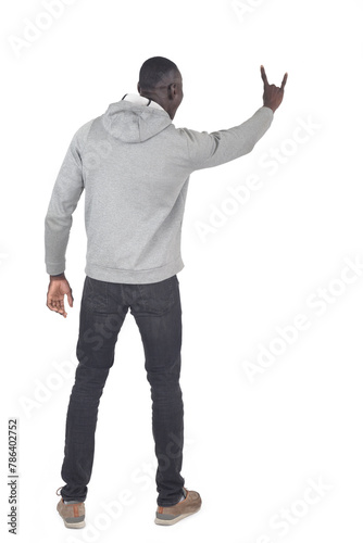 back view of a man showing the horns sign with fingers on white background