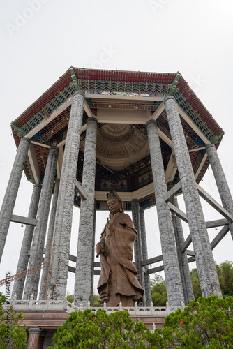 The Buddha Statue of the Chinese Buddhist Temple Kek Lok Si to the City of George Town on Penang in Malaysia