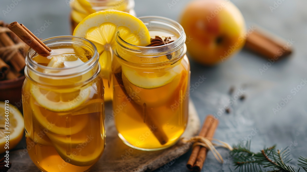 Apple cider vinegar detox drink with honey, lemon, and cinnamon in a mason jar. Apple cider vinegar detox drink with honey, lemon, and cinnamon in a mason jar.