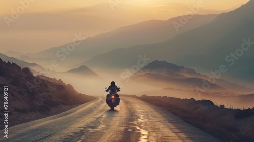 Luxury cruiser motorcycle with the soul of a lone wolf, riding through misty mountains at dawn, first light breaking through photo